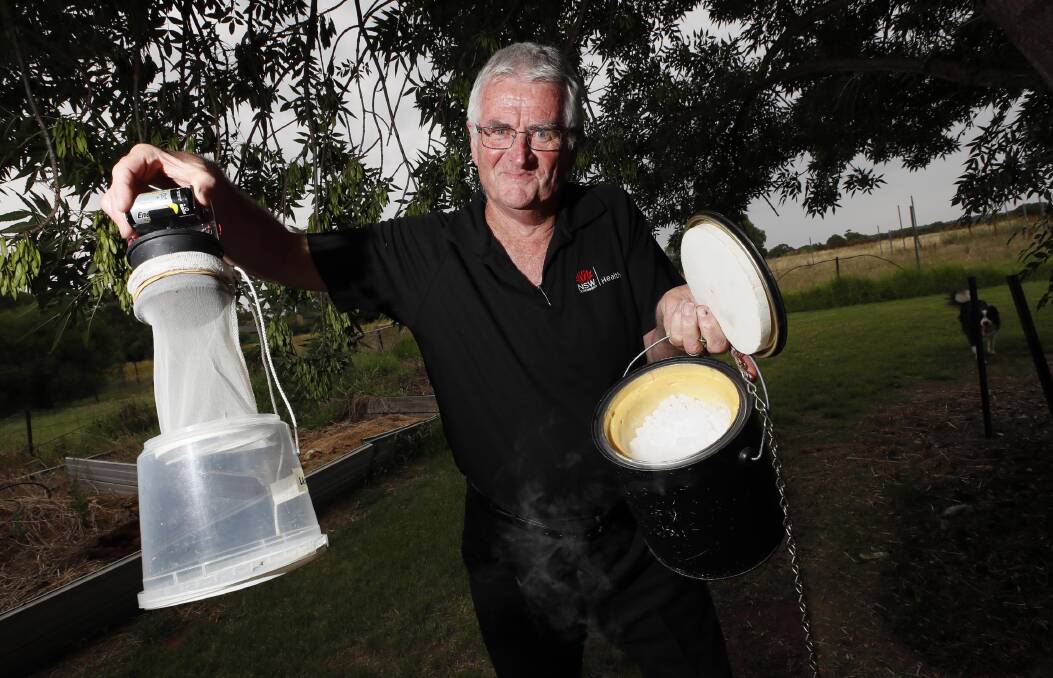 ITCHY BUSINESS: MLHD senior environmental health officer Tony Burns sets up mosquito traps to deter the species irritating residents. Picture: LES SMITH