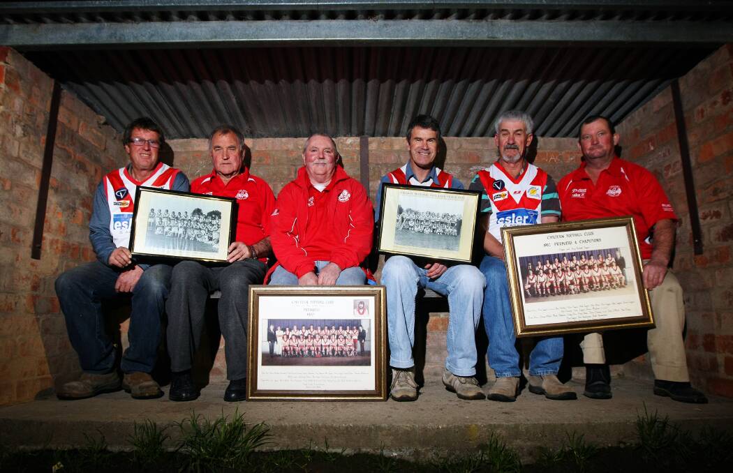 GLORY DAYS: Bill Peake (second from left) with premiership players from Chiltern's 1971, 1972, 1982 and 1983 flags.