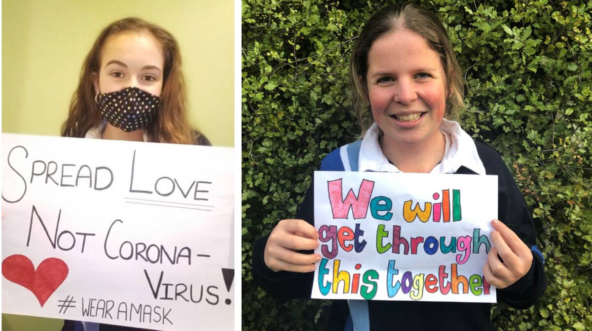 POSITIVE: Tallangatta Secondary College students Grace Carney and Amy Wood with two important messages.