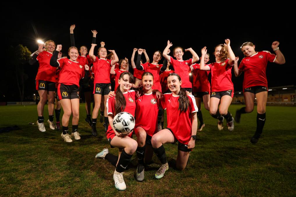 Kiera Allen, 13, Molly Spry, 13, and Eve O'Connor, 14, surrounded by their Murray United club mates, are excited for the FIFA Women's World Cup to kick-off on Thursday when Australia takes on Ireland. Picture by James Wiltshire