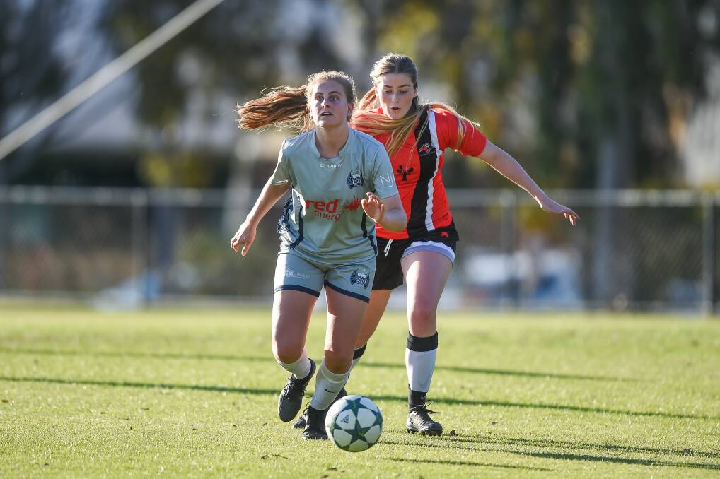 CLASSY PLAYER: Calder United captain Emma Robers takes on AWFA star Maya Davis during the WNPL club's clash with the Border representative outfit in 2018.
