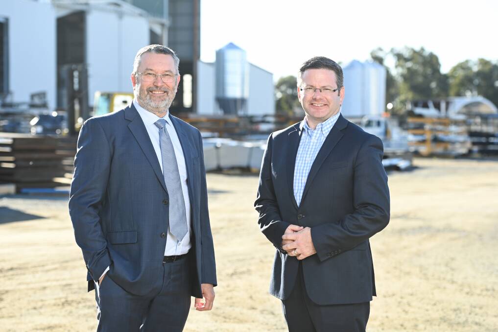 COUNTRY CHANGE: Kotzur managing director Andrew Kotzur and Minister for Multiculturalism Mark Coure launching the NSW Growing Regions of Welcome pilot program in Walla on Tuesday. The initiative aims to attract migrants and refugees to regional areas. Picture: MARK JESSER 