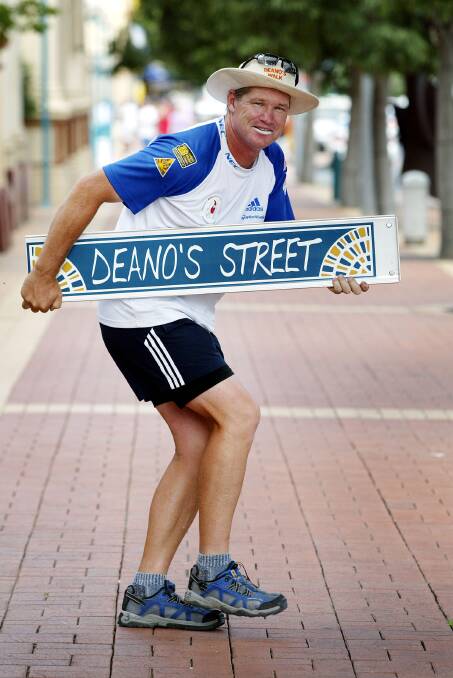 FLASHBACK: Dean Jones in Dean Street with the 'Deano's Street' sign specially made during his visit to Albury for his Bone Marrow Donor Institute fundraising walk in 2003. 