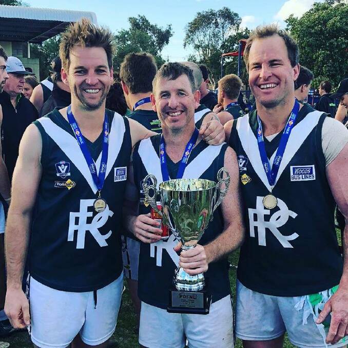 BACK TO BACK: Rennie coach Craig Ednie (middle) with Judd Porter and Brad Murray after winning the 2018 Picola and District premiership.