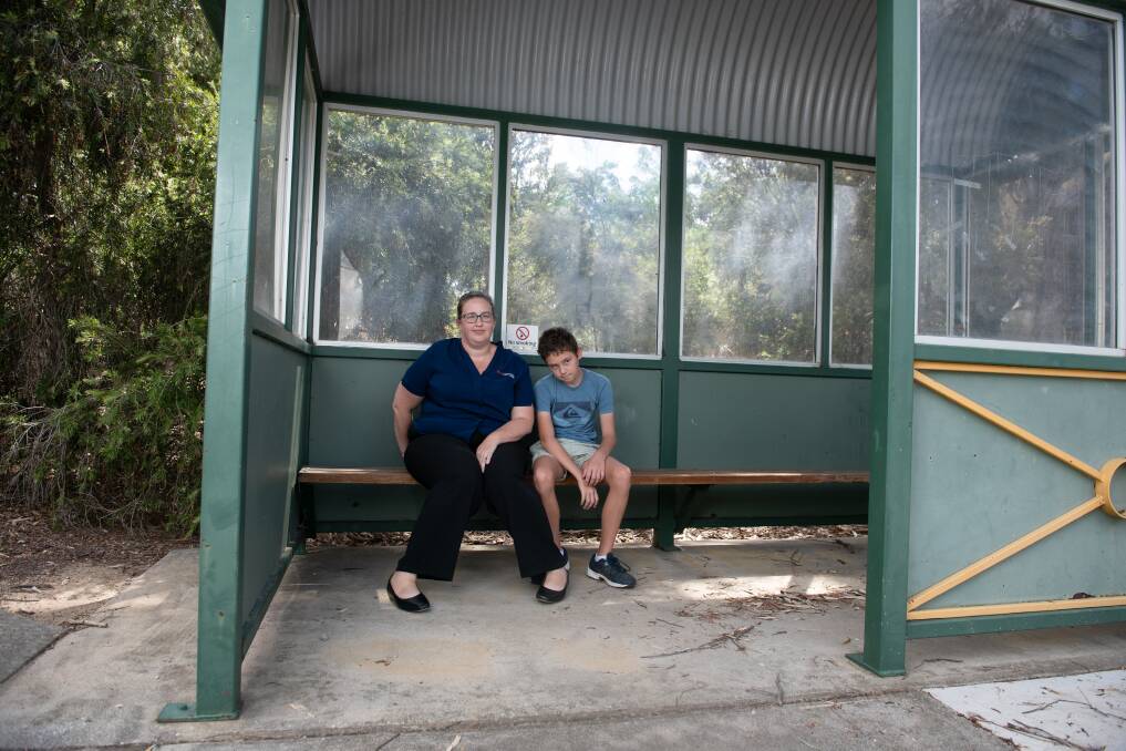 Christine Barnett and son Lachlan, 12, can't hide their disappointment as a lack of seats means he won't be able to catch this bus into Catholic College Wodonga. Picture by Tara Trewhella