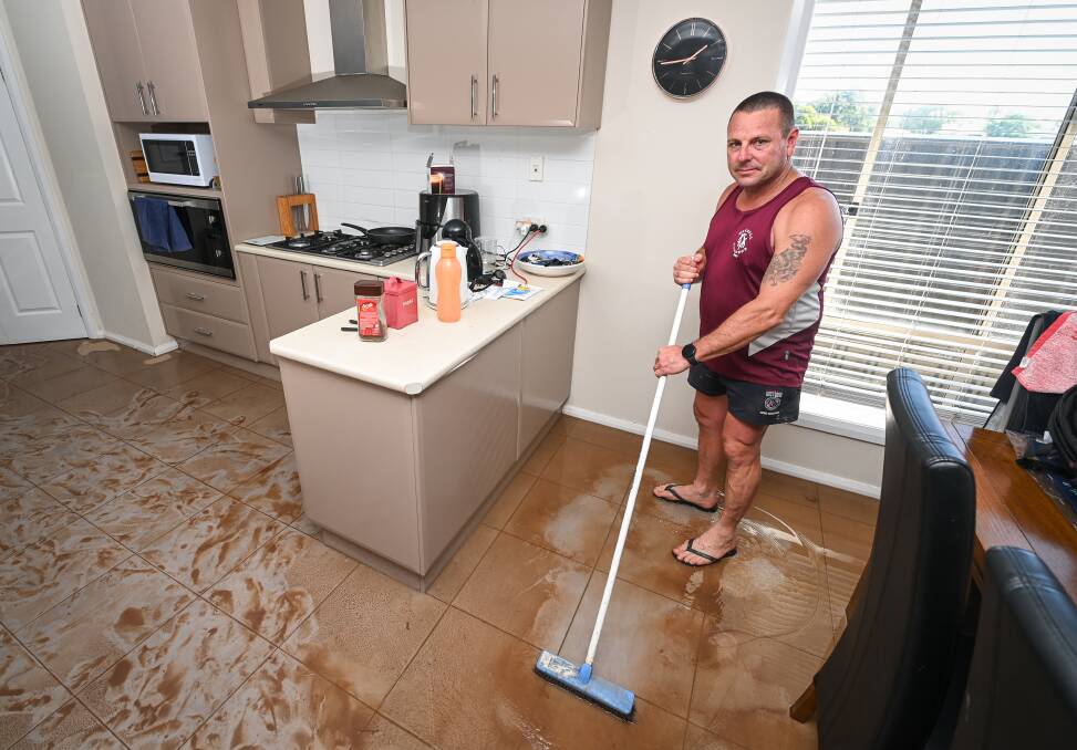 WORK TO DO: Noel Halton was left with an unexpected clean-up on Sunday morning as his Hunter Street home flooded after a massive downpour at Rutherglen.