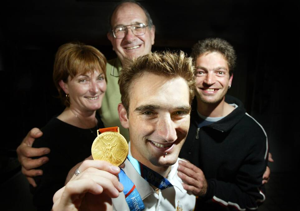 GOLDEN MEMORY: Corowa's Stephen Mowlam with mother, Libby, father, Paul and brother, Glenn, after winning gold at the 2004 Olympic Games.