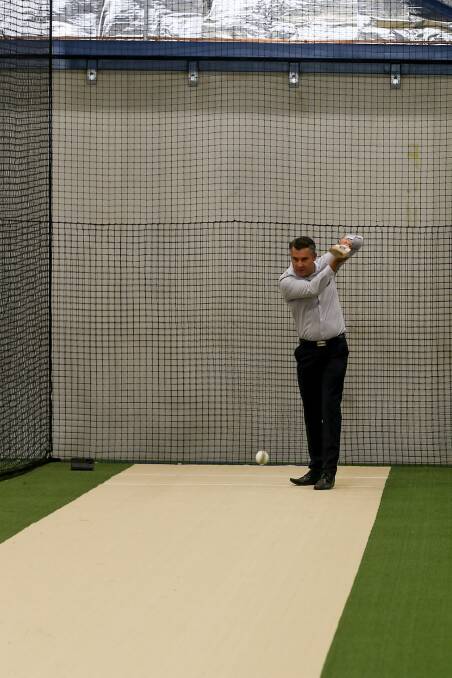 SHOT: Wodonga Councillor Graeme Simpfendorfer tests out one of the pitches at the handover of the Albury Wodonga Regional Cricket Centre.