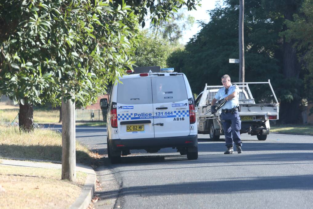 Albury police removing what appear to be makeshift tyre spikes from Captain Cook Drive in North Albury on Tuesday, February 27. Reports of similar instruments on the street have since been made. Picture by Blair Thomson