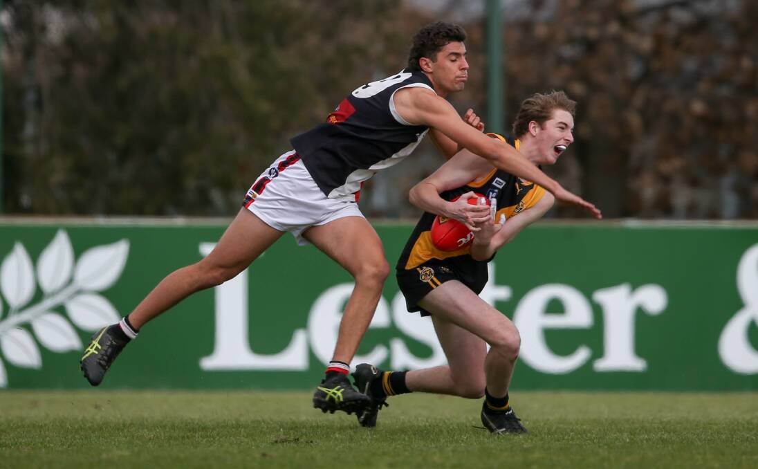 DESPERATION: Myrtleford's Ryley Bouker (left) has been the Saints' leading goal-kicker in the thirds competition with 48 majors. Bouker has kicked six in Myrtleford's three finals matches. Picture: TARA TREWHELLA