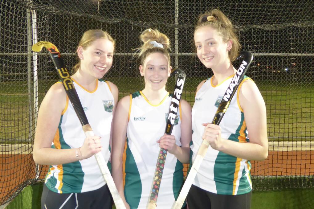 EXCITED: Millie Nagle, Emma Pontt and Laura Fellows are in Hockey Albury-Wodonga's under-18 girls team for the Junior Country Championships. Picture: CAYTE CAMPBELL