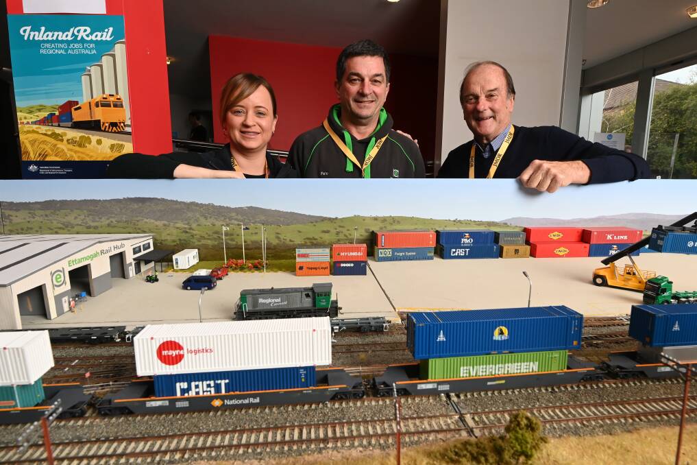 MODEL VERSION: Ettamogah Rail Hub's Kellie Rees and Colin Rees stand behind Peter Allen's (centre) model of the Ettamogah Rail Hub, which featured at the Inland Rail conference in Albury in 2021. Picture: MARK JESSER