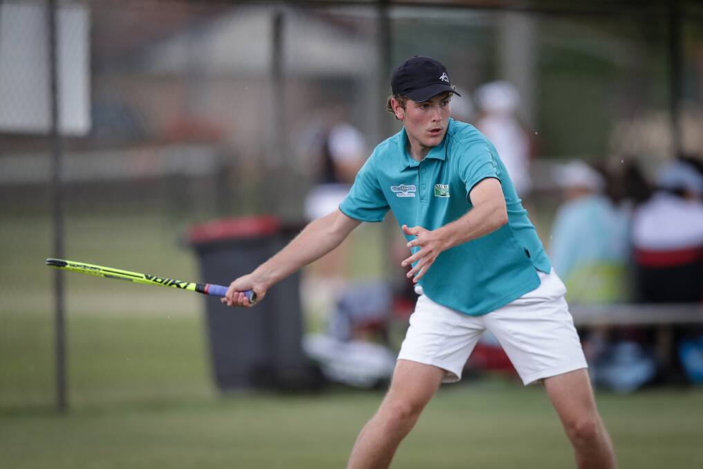 WINDING UP: Bright P-12 College product Daniel Neville connects with a forehand at Australian Schools Tennis Challenge at the Albury grasscourts on Tuesday. Picture: JAMES WILTSHIRE