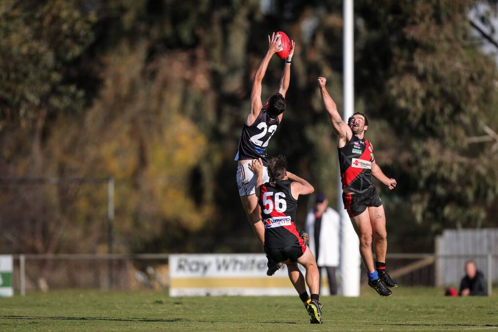 TALLENT TIME: Keith Tallent takes a towering grab on his way to kicking four majors to help Brock-Burrum to a 21-point win at Howlong on Saturday. Picture: JAMES WILTSHIRE
