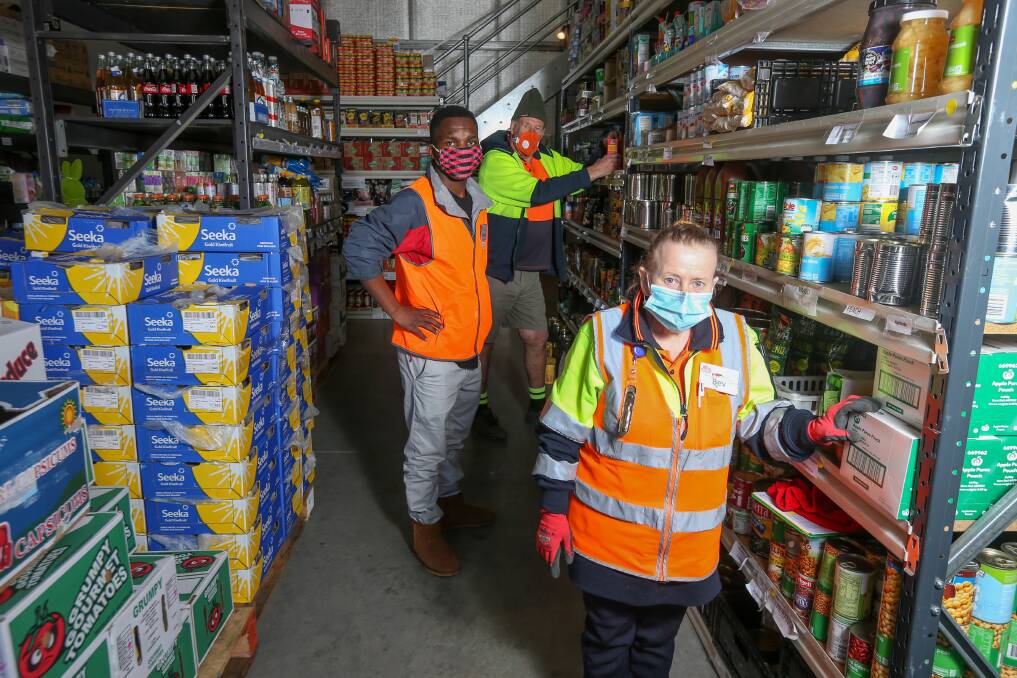 ASSISTANCE: Albury Wodonga Regional FoodShare volunteers Bev Campbell, Valentin Runanika and Doug Gammon will benefit from a grant of almost $4000 used to buy an air conditioner for the staff area. Picture: TARA TREWHELLA