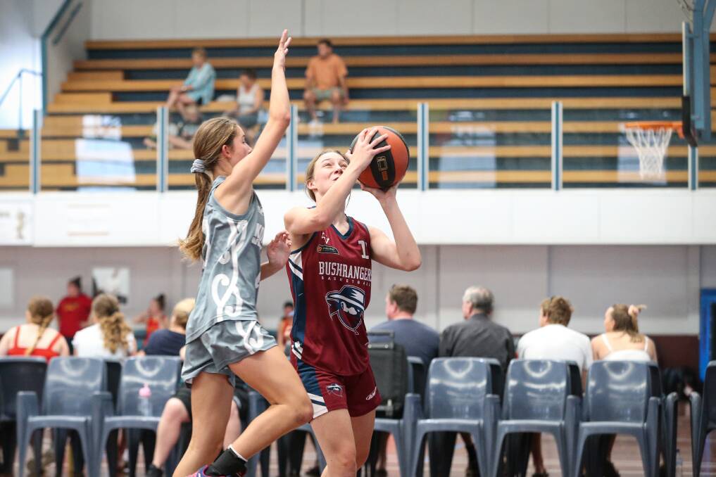 TOUGH SHOT: Wodonga's Ruby Watson is put under pressure by New Zealand Kea's Hannah Lee during Friday's finals action for the under-16 girls. Picture: JAMES WILTSHIRE