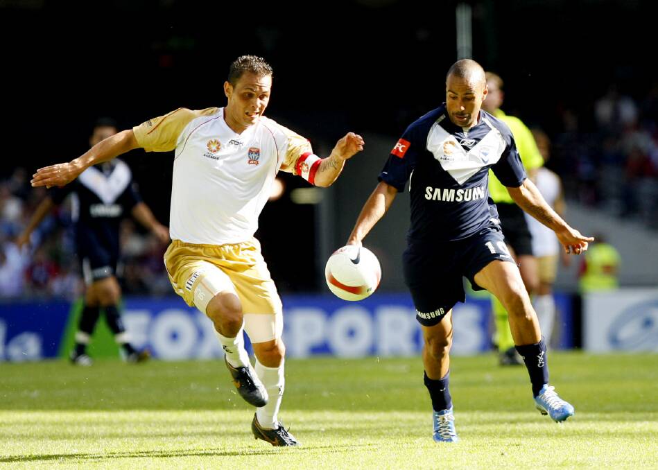Jade North and Archie Thompson go head-to-head during the 2007-08 A-League season. Picture: VINCE CALIGIURI