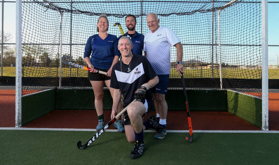 STATE DUTIES: Sherren Rahaley, Jeremy Maggs, Dennis Martin and Brett Pontt (front) are contesting the National Masters Hockey Championships. Picture: TARA TREWHELLA