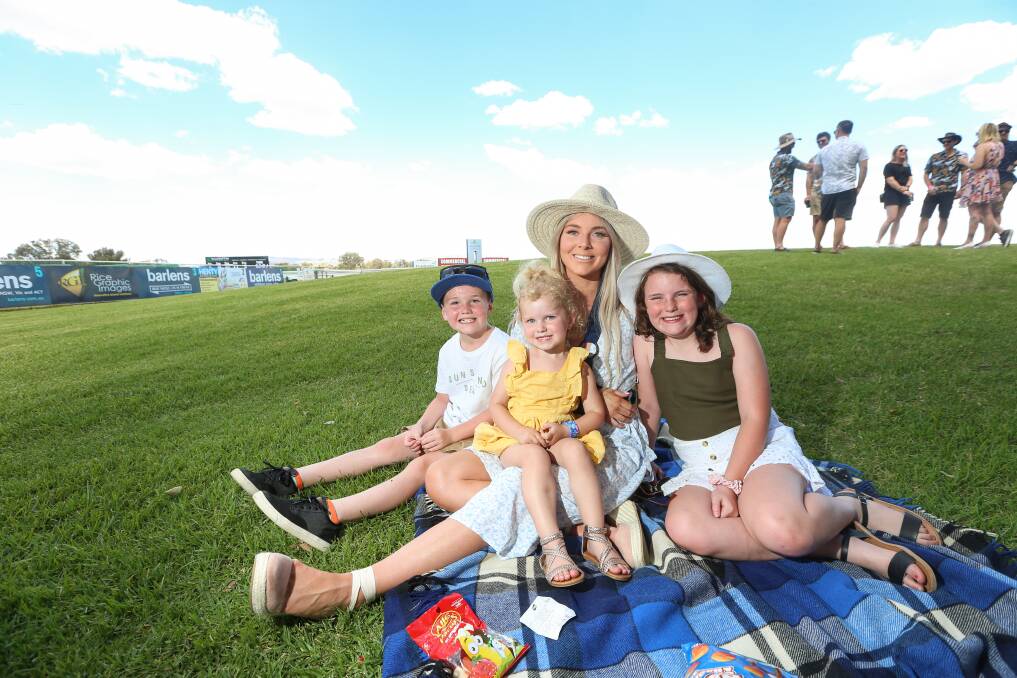 FUN: Canberra's Kass Henry, Trey, 7, Bethani, 2, and Aleyah Rootsey, 8, at their first Albury Boxing Day races. Picture: JAMES WILTSHIRE