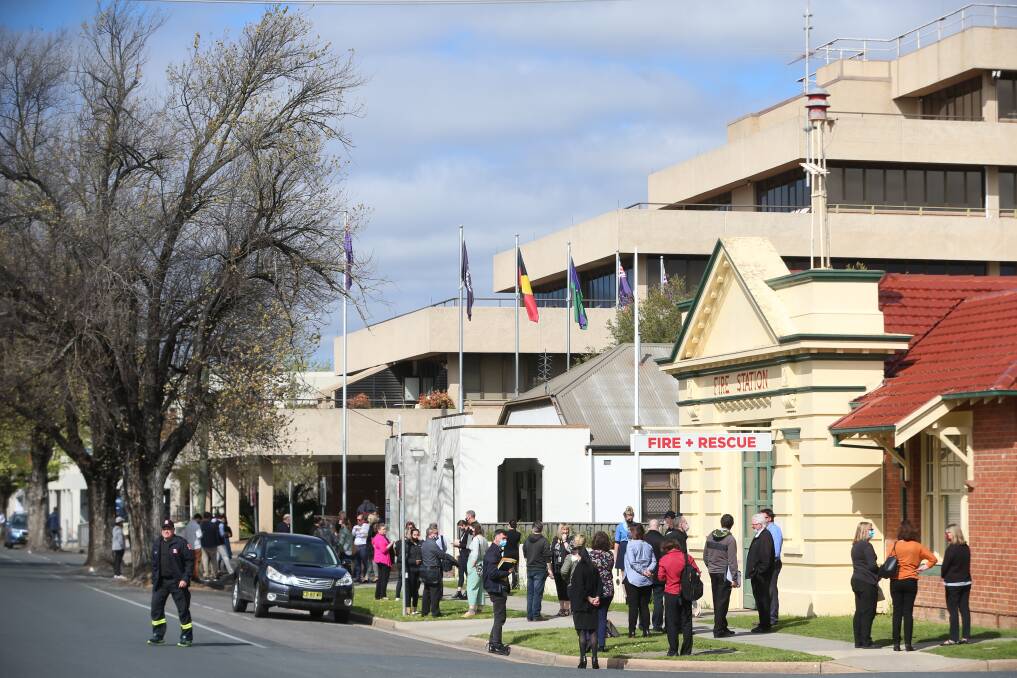 PRECAUTION: Staff evacuate the Albury Council offices after the Victorian earthquake on Wednesday. Picture: JAMES WILTSHIRE