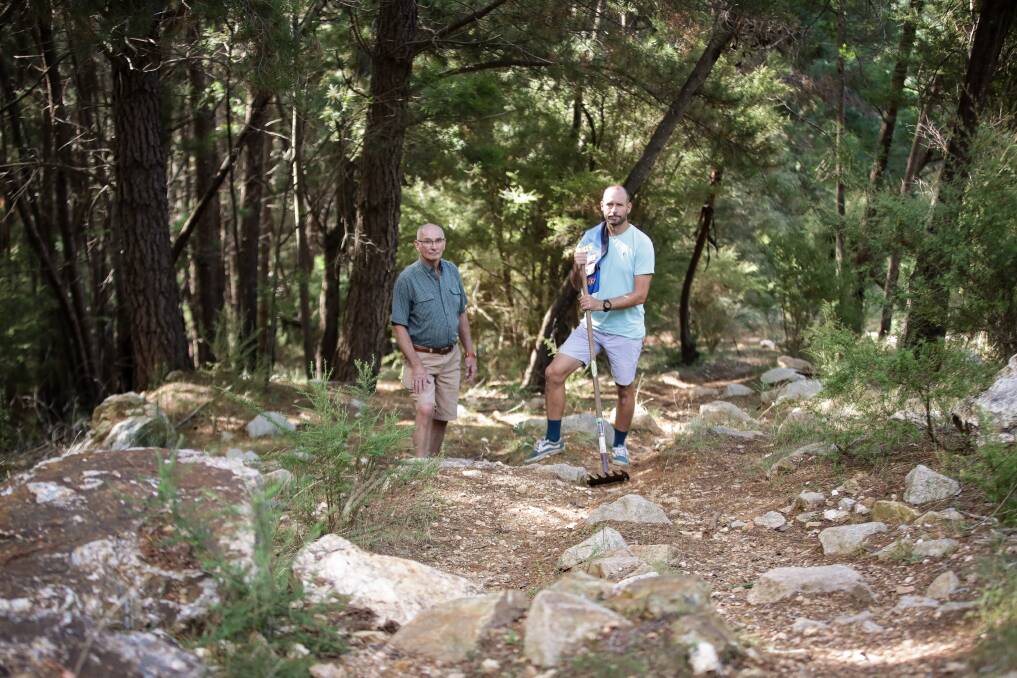 TEAM EFFORT: David and Mark McDougall, with help from Alpine Cycling Club members, spent around three months hand cutting the first downhill mountain bike trail in Bright in 1998. Mystic downhill helped take Australian mountain bike racing to a new level. Picture: JAMES WILTSHIRE