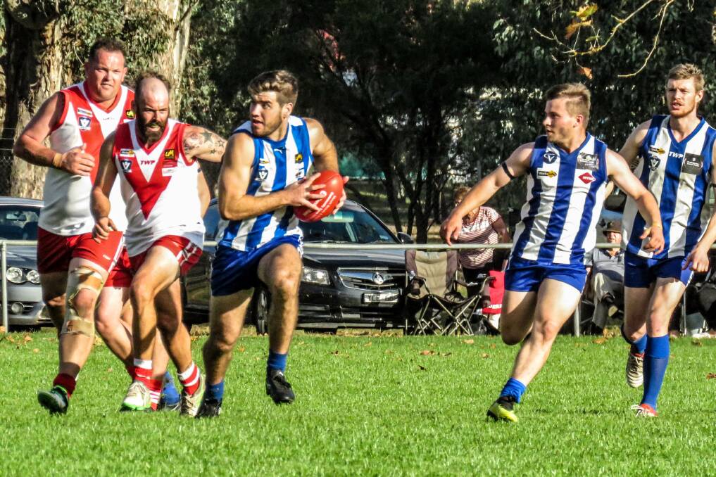 IN THE CLEAR: Tumbarumba's Harry Nunn has close back up from Mitchell Deluca during the Roos' huge win against Federal. Picture: WENDY LAVIS