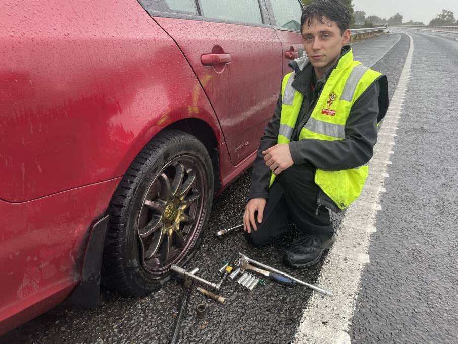 Albury's John Osborne was among several motorists forced to make tyre changes on the side of the Hume Freeway after hitting a pothole on Thursday. Picture by Victoria Ellis