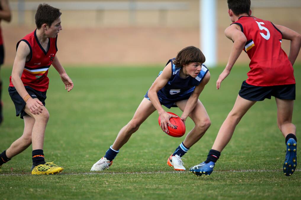 IN AND UNDER: Xavier High School's Harryson Barber lined up for Combined Catholic Colleges at the NSW All Schools football trials. Picture: JAMES WILTSHIRE