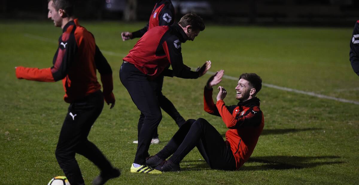 ALL SMILES: Murray United captain Ashley Dunn and defender Alex West see the lighter side during the club's final training session before its FFA Cup clash against Bulleen. Picture: MARK JESSER