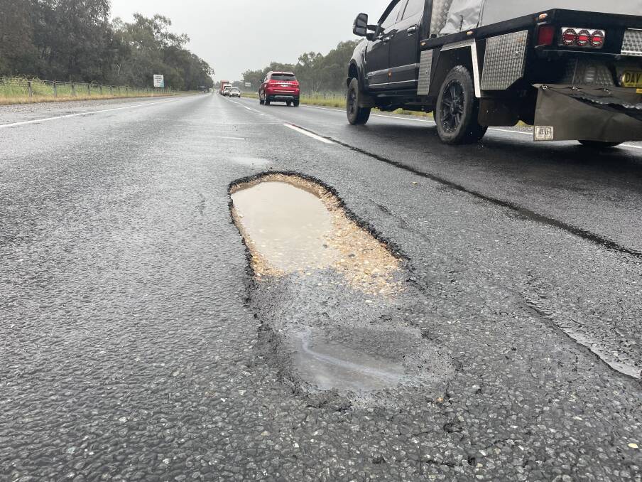 A sizeable pothole on the southbound left lane of the Hume Freeway at Wodonga as caused damage to at least three vehicles. Picture by Victoria Ellis
