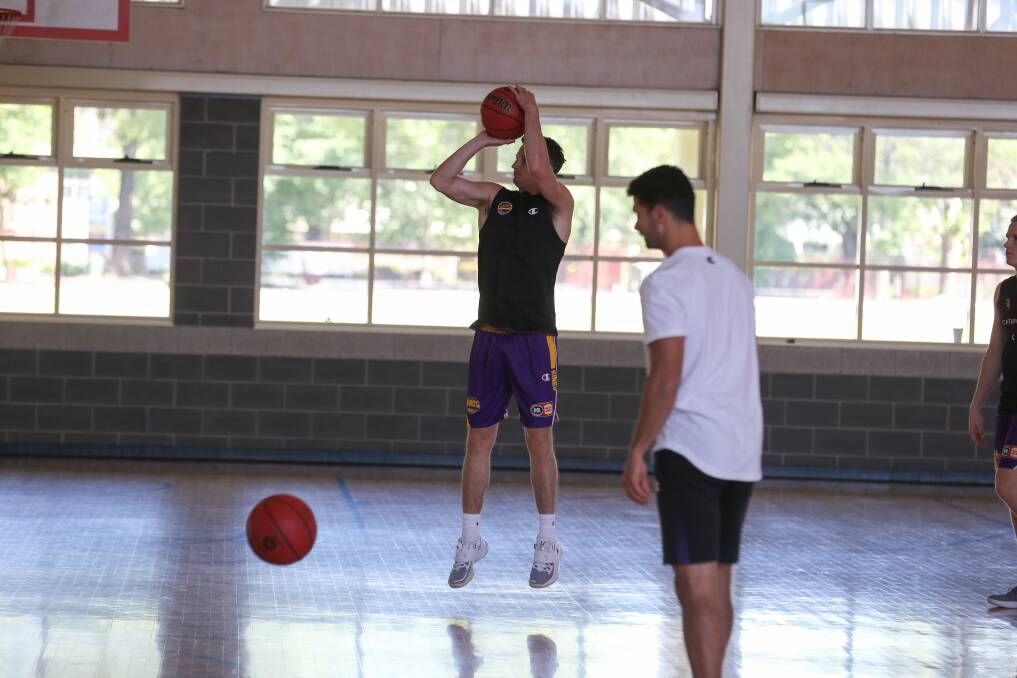 JUMP SHOT: Sydney Kings guard Shaun Bruce completes some shooting practice at The Scots School Albury yesterday. Picture: TARA TREWHELLA