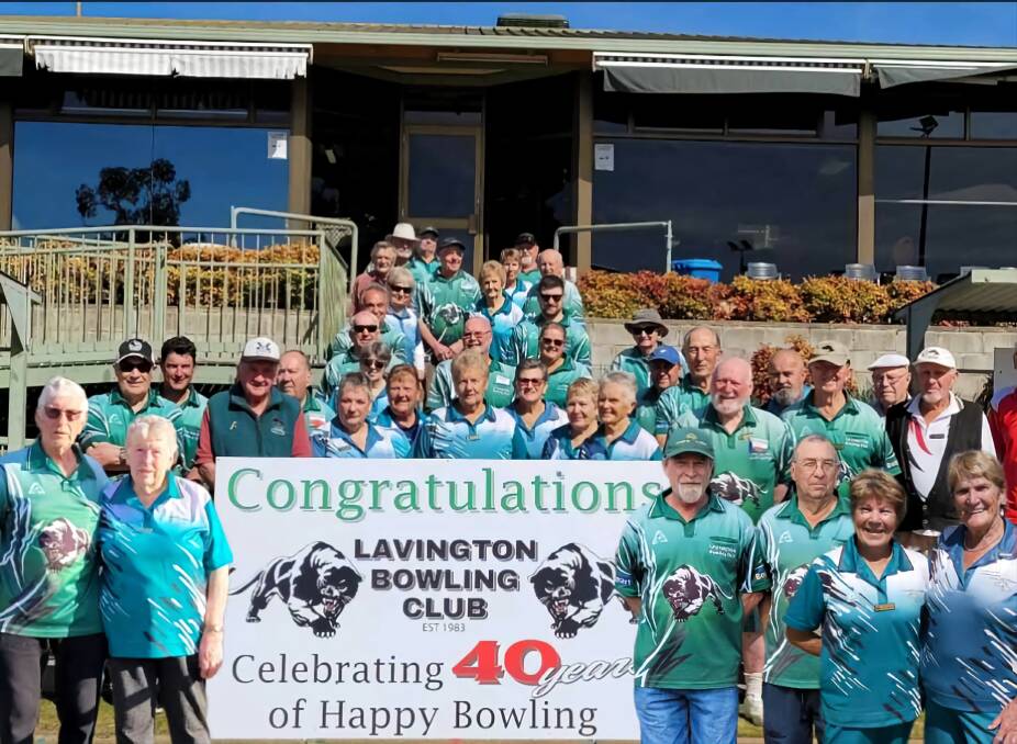 Current Lavington Bowling Club members with a sign to mark the 40th anniversary celebrations. Picture supplied