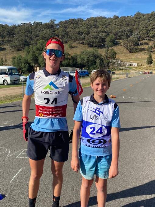 SIBLINGS SALUTE: Brothers Samuel and Edward Johnson, representing Canberra Grammar, celebrate their victory in the open boys North East Victorian interschools biathlon relay. Picture: SUPPLIED