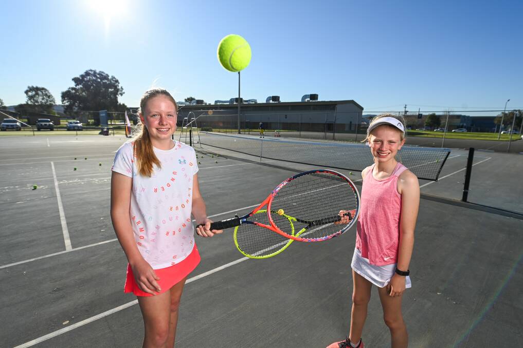 SMASH HITS: Young guns Indi Paton, 13, and Ella McDonell, 10, are looking forward to returning to competition tennis this summer. Picture: MARK JESSER