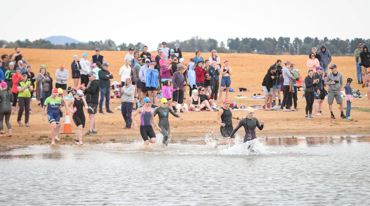 FAST START: Competitors hit the water for the swim leg at Ebden Reserve. Pictures: JAMES WILTSHIRE