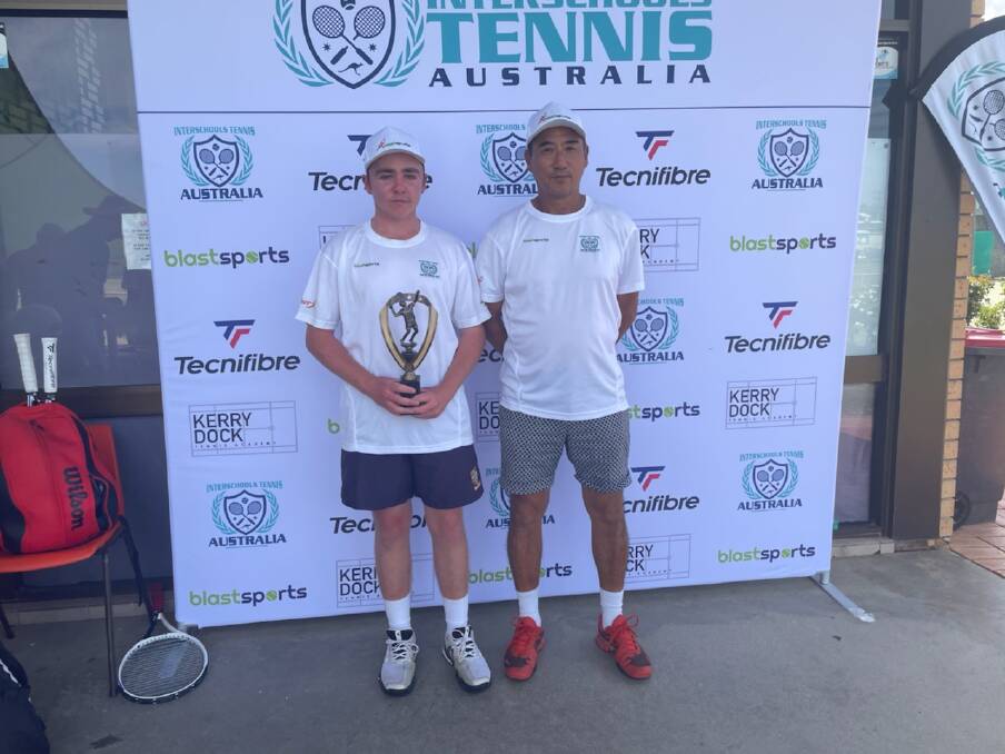FORM PLAYER: The Scots School Albury captain Joel Cook, with Interschools Tennis Australia tournament director Kerry Dock, after winning the most valuable player award.