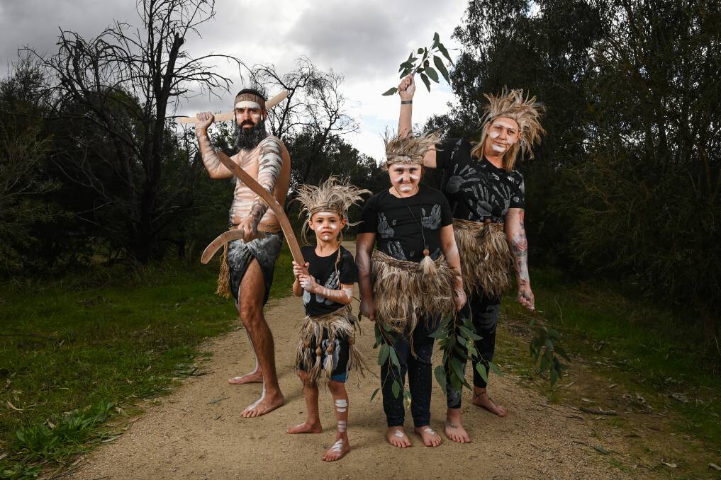 UNITY: Wagarra Wagarra - Our Culture Our Way dance group members Tim Church, Judd Murray, 5, Rubyrose Campbell-Phillips, 8, and Tammy Campbell featured in the opening of Crossing Place Trail on Saturday. Picture: MARK JESSER