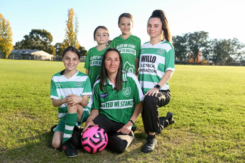 FAB FIVE: Karen Milne is a mother to six girls, four of which play for Albury United. Milne and daughters Kyanna, 11, Willow, 6, Maysie, 9, and Netaya, 15, will all feature for the Greens this weekend in AWFA's Female Football Round. Picture: TARA TREWHELLA