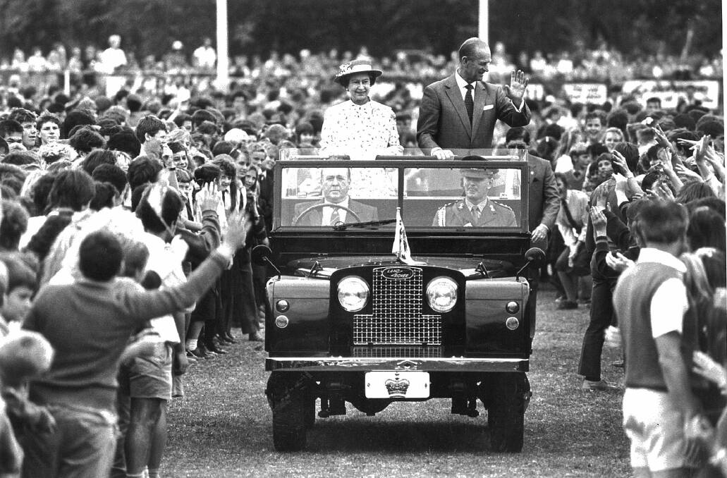 Queen Elizabeth II and Prince Philip wave to hundreds of school children on the centre of the Albury Sportsground during their visit to the Border city in 1988.