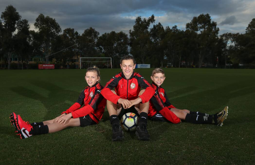 TRIPLE THREAT: Brothers Lachy, 13, Liam, 15 and Hunter, 10, impressed during their time playing at Myrtleford and Murray United and will look to continue their progression when they return to Canada. Picture: TARA TREWHELLA