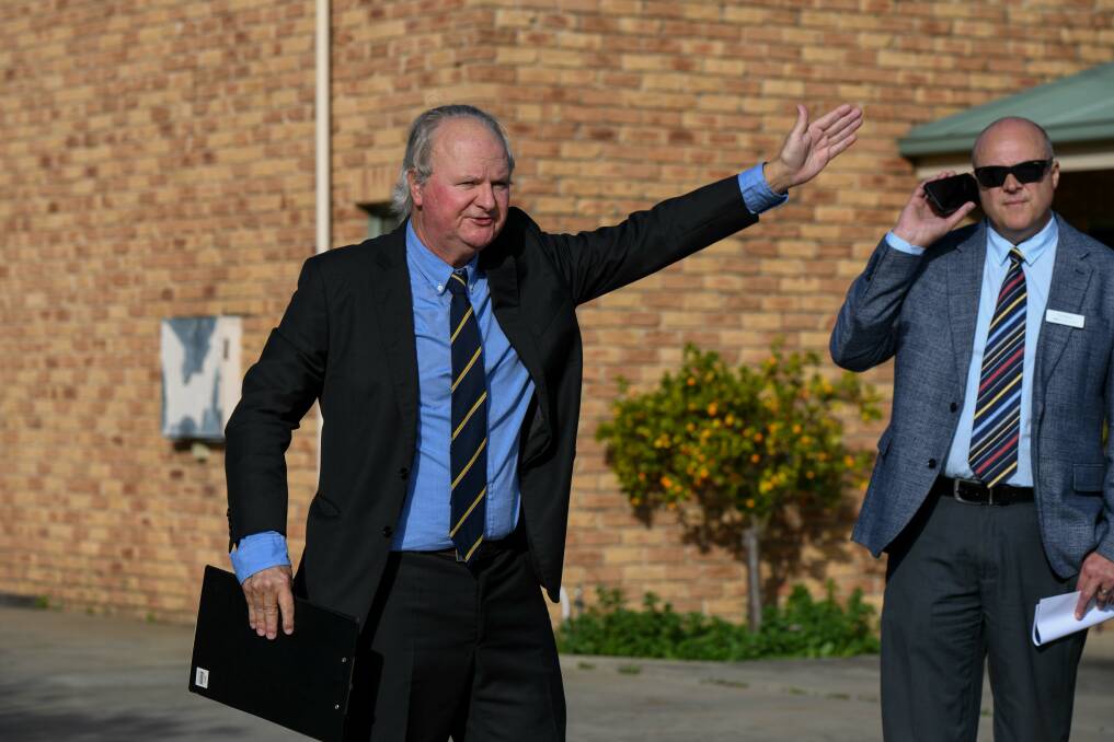 Dixon Commercial Real Estate's Andrew Dixon calling for bids during the auction of an established North Albury industrial warehouse on Friday, June 2. Picture by Tara Trewhella