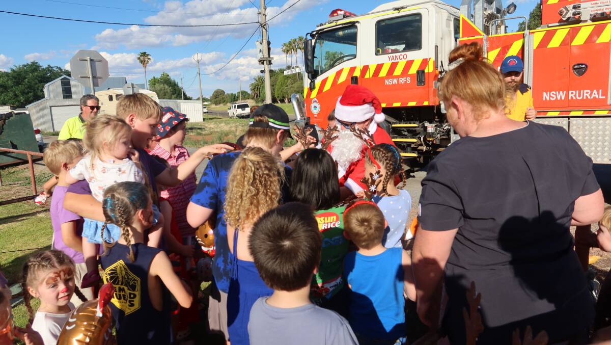 Santa Claus was mobbed at the Yanco Twilight Markets over the weekend, with the event well supported in just its second outing. Picture supplied