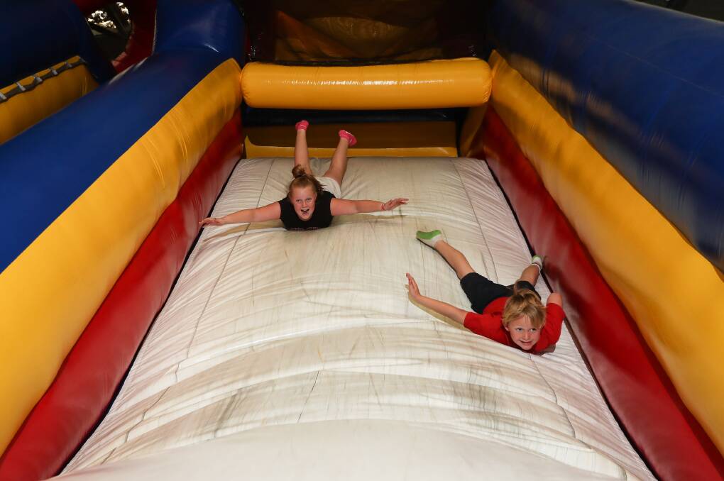 SERIOUS FUN: Paije Wager, 12, and Nate Holland, 7, in high spirits ahead of Sunday's Relay for Life fundraiser for the Goodstart Early Learning team at Inflatable Funhouse Wodonga. Picture: JAMES WILTSHIRE