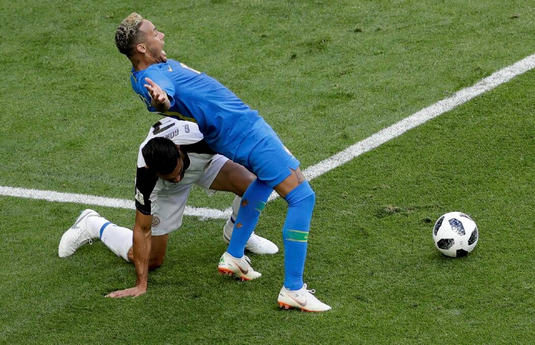 YOU'RE KIDDING: Dives like that by Brazil's Neymar - who played for a penalty after minimal contact against Costa Rica - make the "world game" a joke, a reader says. 