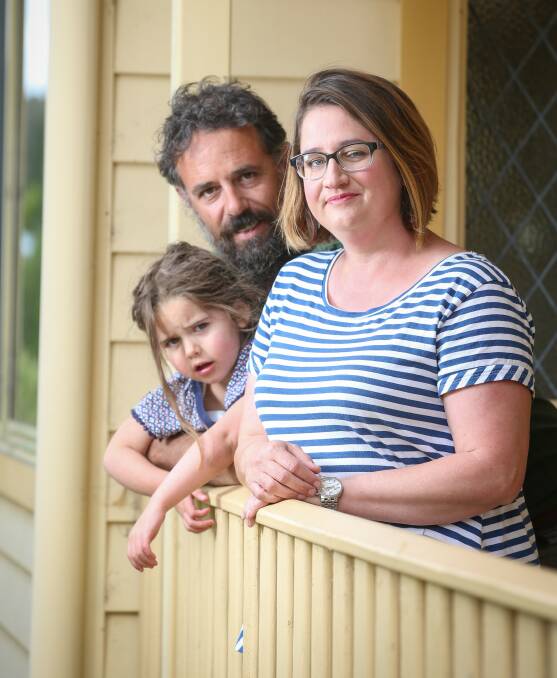 NICE TO BE HOME: Sarah Waters, pictured with partner Andrew and daughter Sadie, 4, is back home in Beechworth after surgery. Picture: JAMES WILTSHIRE