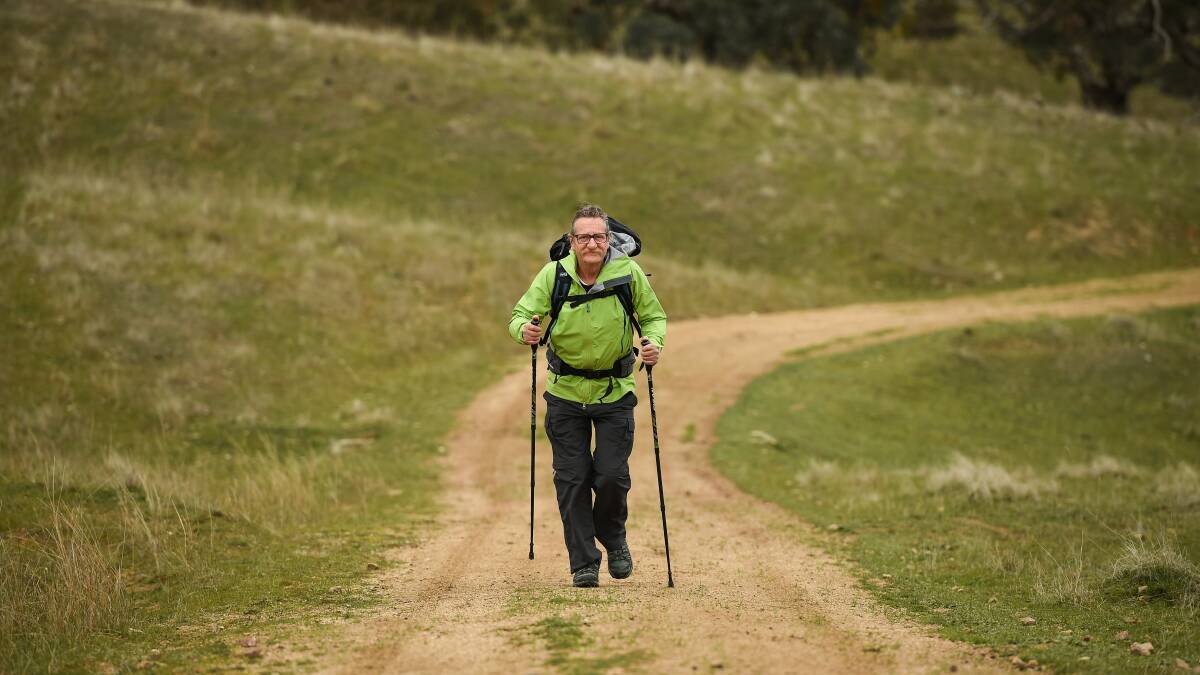 FIRST STEPS: Mike Coen takes a stroll in the undulating countryside of the Wymah Valley as he prepares for his epic walk to raise funds for Meg's Children Nepal. Picture: MARK JESSER