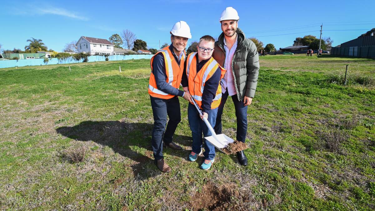 BOON: Good Housing co-founders Sam Graiche and Antony Anisse turn the first sod of the Lavington housing project with BJ. The initiative will provide purpose-built accommodation for five people with a disability. Picture: MARK JESSER
