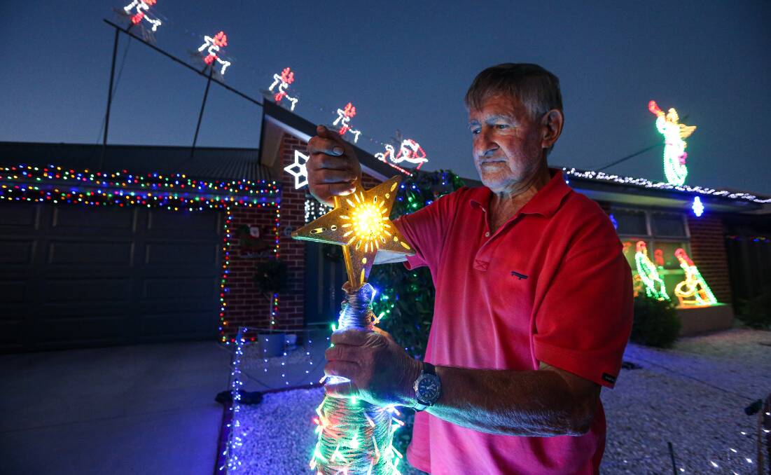 GENEROSITY: Kevin Allitt has decorated his home in Thurgoona with Christmas lights, and is collecting donations for the Albury Wodonga Regional Cancer Centre as part of his display. Picture: JAMES WILTSHIRE