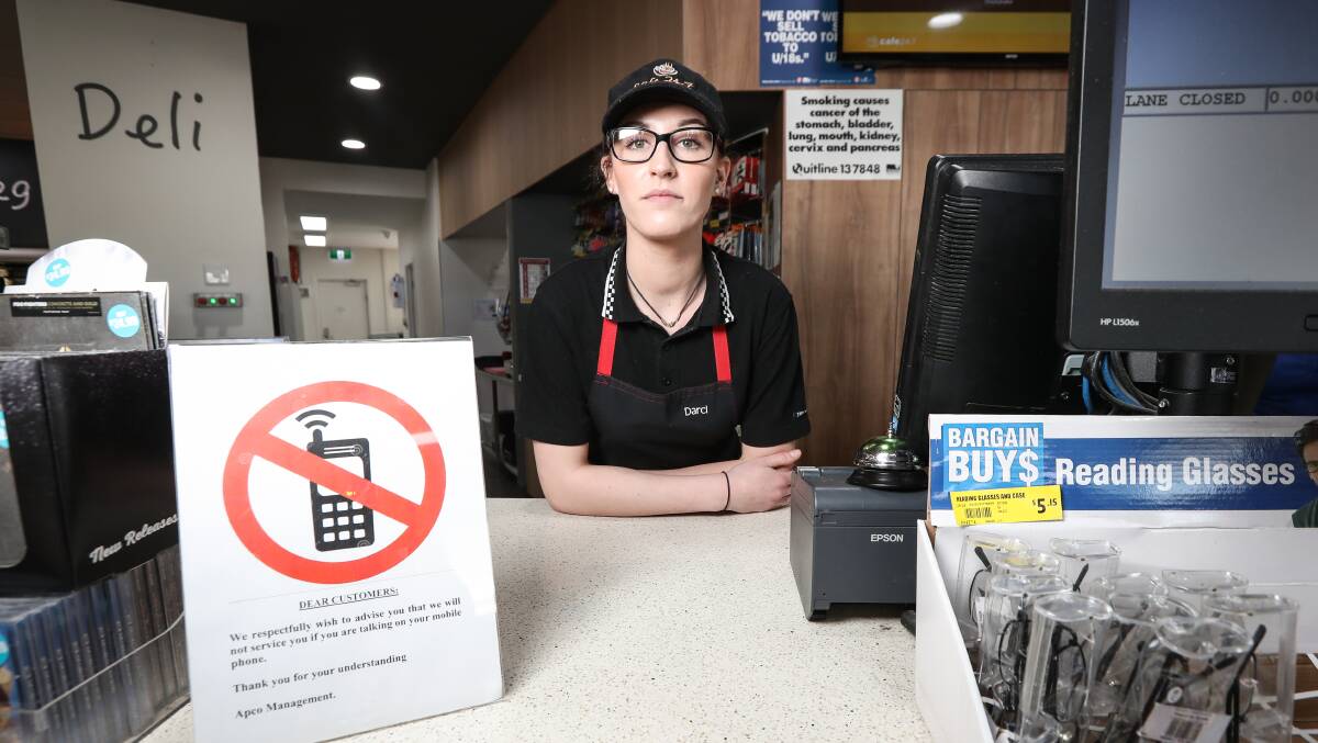 WE REFUSE RUDE: APCO Wodonga barista Darci D’Helin-Lawrie. Most readers back APCO's policy to not serve people who are on mobile phones. Picture: JAMES WILTSHIRE