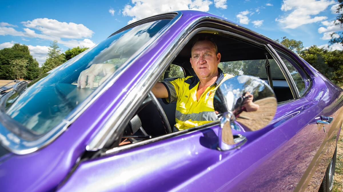 DRIVER'S SEAT: Glenn Huxley in his 1971 Dodge Demon 340, among 700 cars from every state and territory in Australia on the Border for Chryslers on the Murray. 